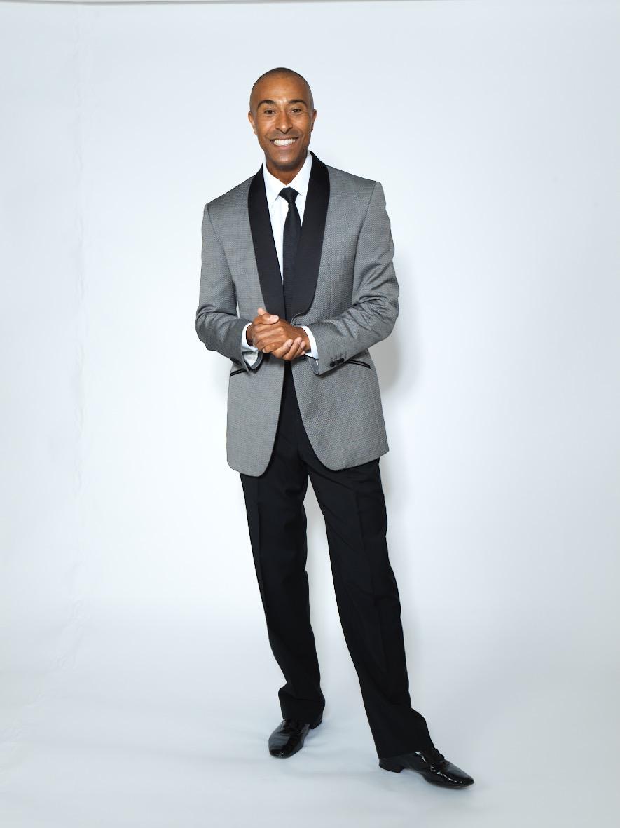 Colin Jackson CBE in a grey suit